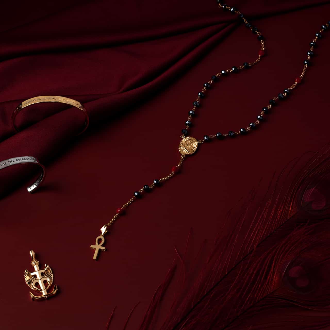 mary magdalene jewelry on red silk